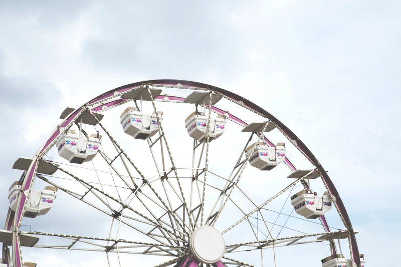 a large white and pink ferris - carnival ride