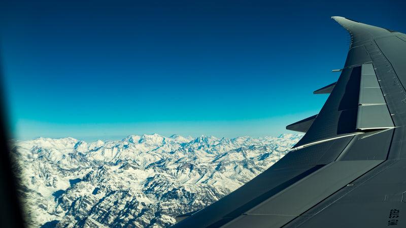 a view of the mountains from the airplane - flight over mountains